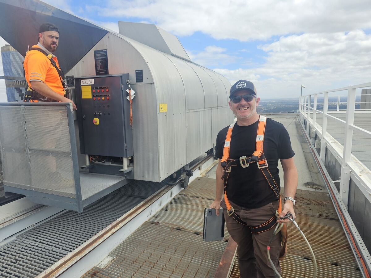 SiteOps team on high-rise rooftop preparing for structural investigation
